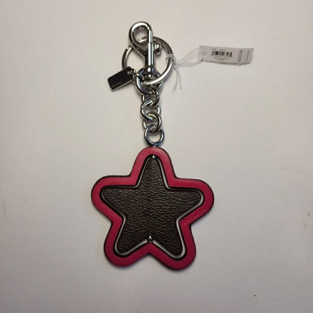 NWT Coach CP899 Spinning Star Bag Charm In Signature Canvas Bright Violet